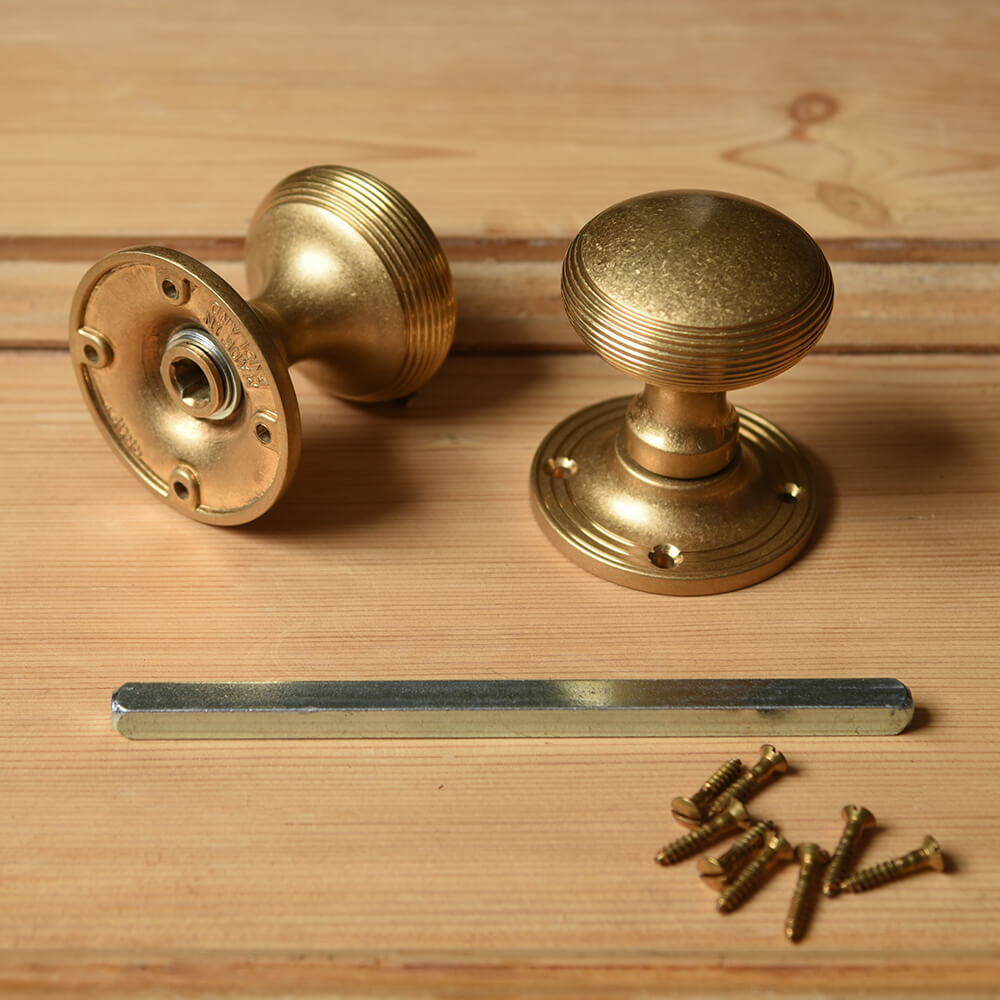 Aged Brass Reeded Cushion Door Knobs parts