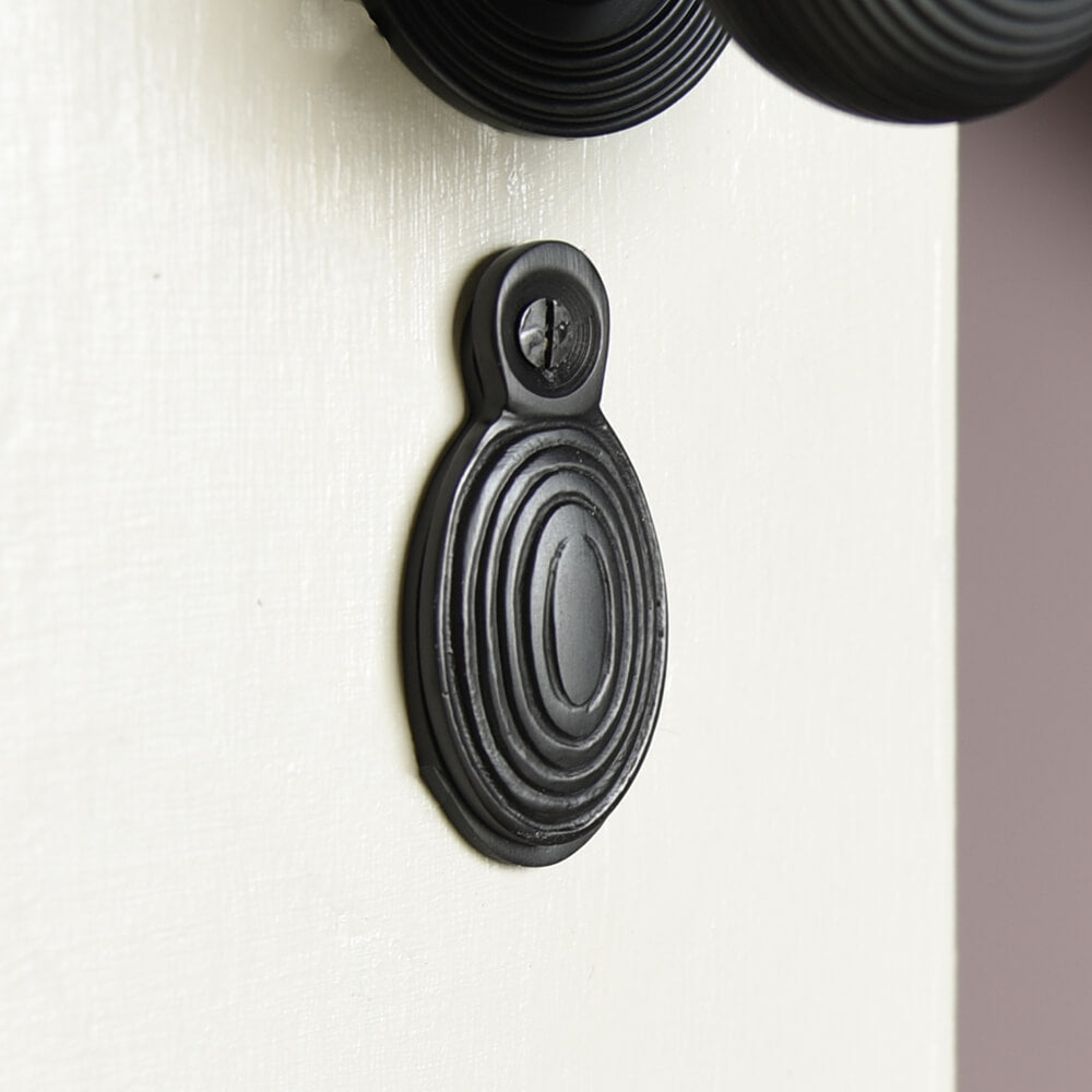 Oval black keyhole cover