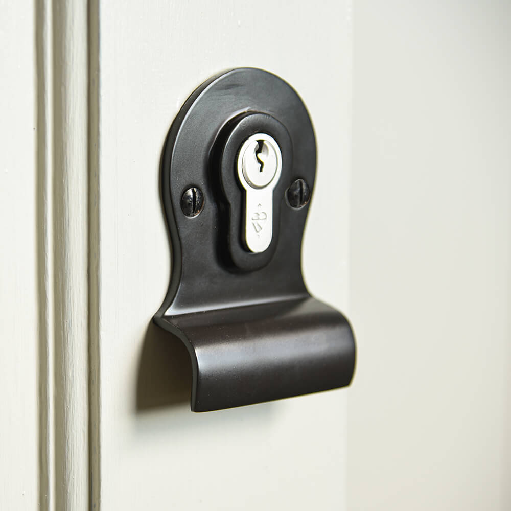 Black cylinder latch pull on door