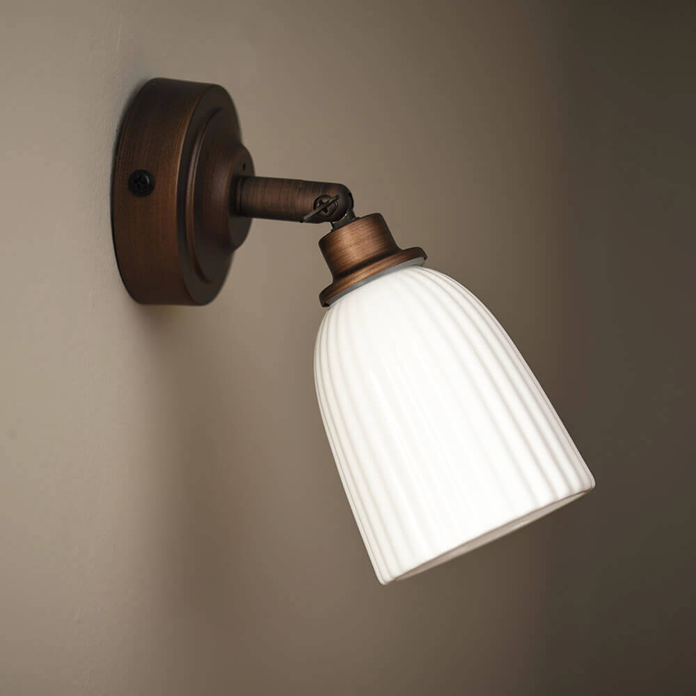 Antique Bronze Alma Bathroom Light on stone coloured wall