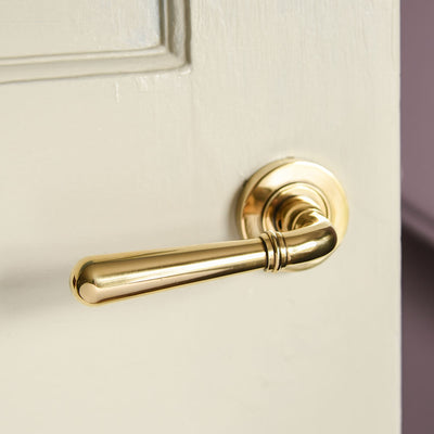 Polished Antique Brass Newbury Lever Door Handles on Concealed Rose