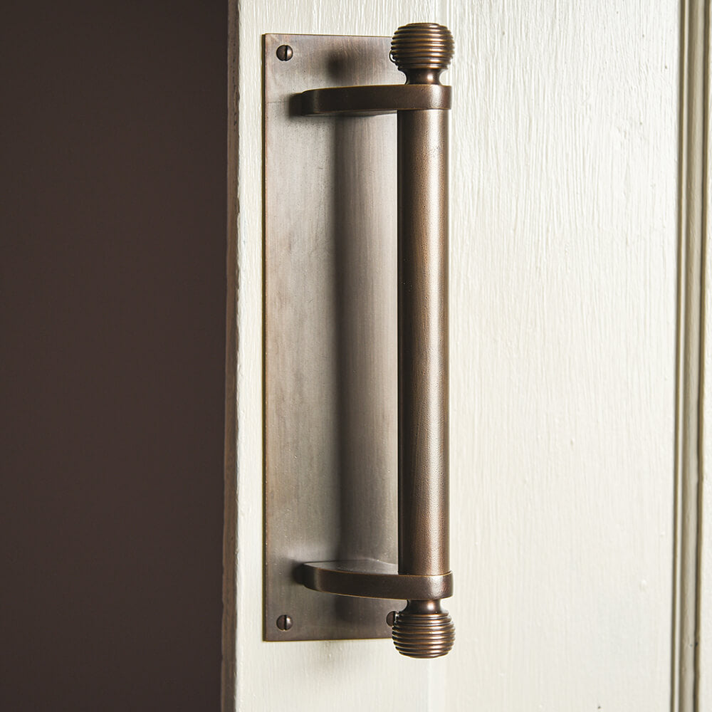 Large door pull handle with beehive finials top and bottom