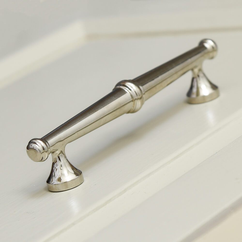 Smallest Elongated nickel plated drawer pull in a decorative Regency style