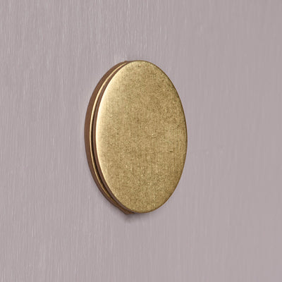 Ageed Brass oval keyhole cover on a lilac door