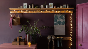 Pink and purple hallway with christmas lights