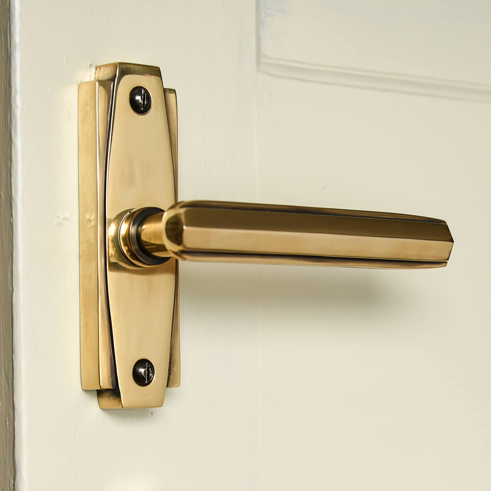 Polished Antique Brass Art Deco Lever Latch Door Handles showing deco detail