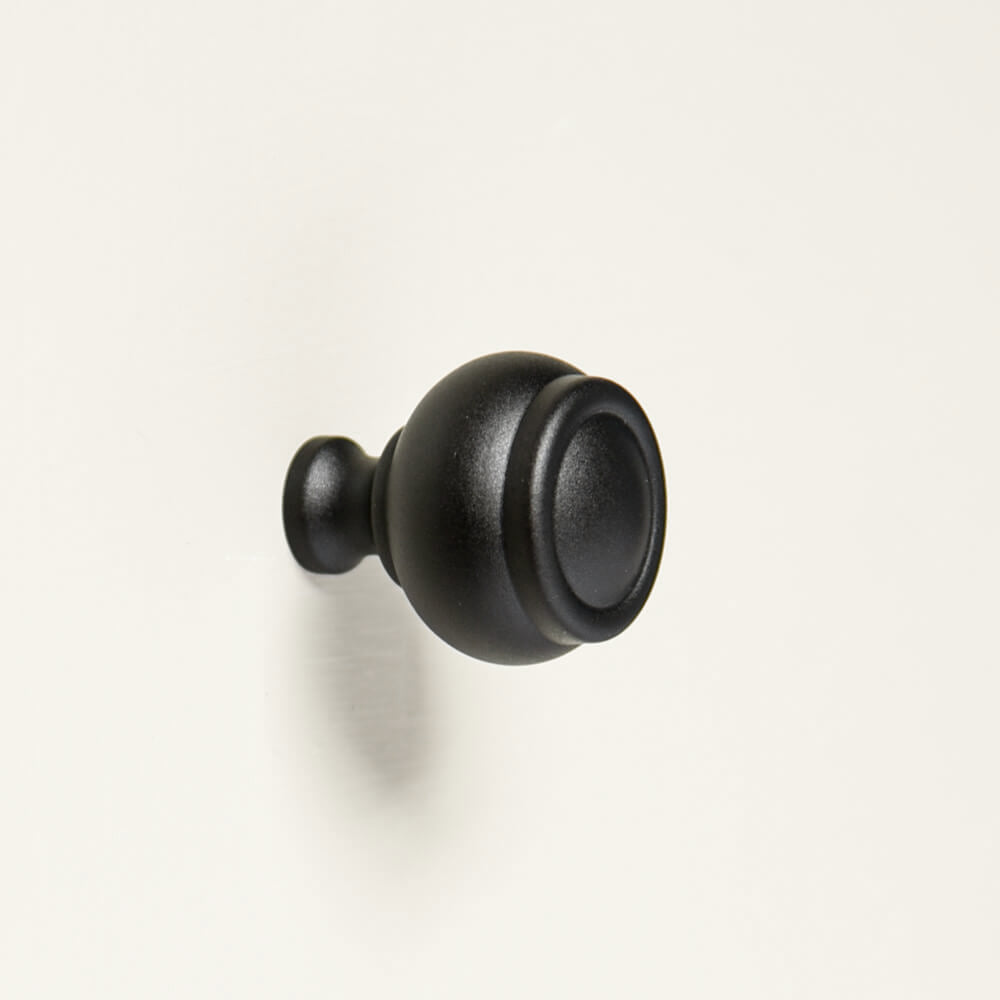 Zero-Black-Ovolo-Cabinet-Knob-with-small on white door